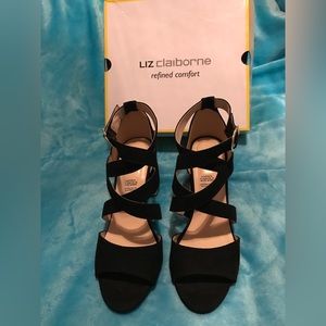 Black chunky heel with gold on the shoe.